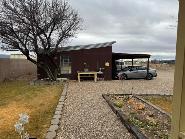 View of home's exterior with a carport