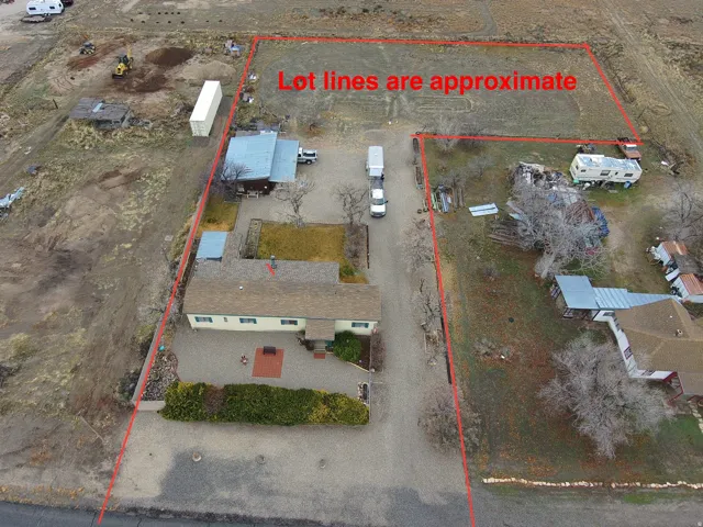Aerial view of sparsely populated area featuring property boundaries highlighted