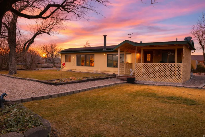 View of front of home with a yard
