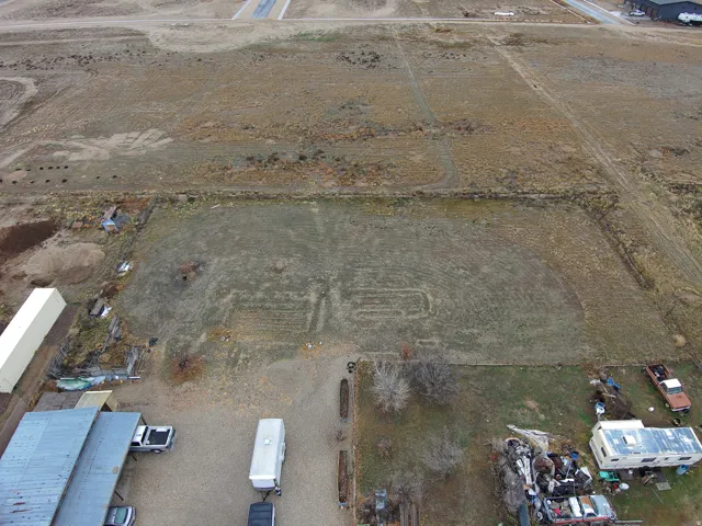 Aerial view of property and surrounding area featuring rural landscape