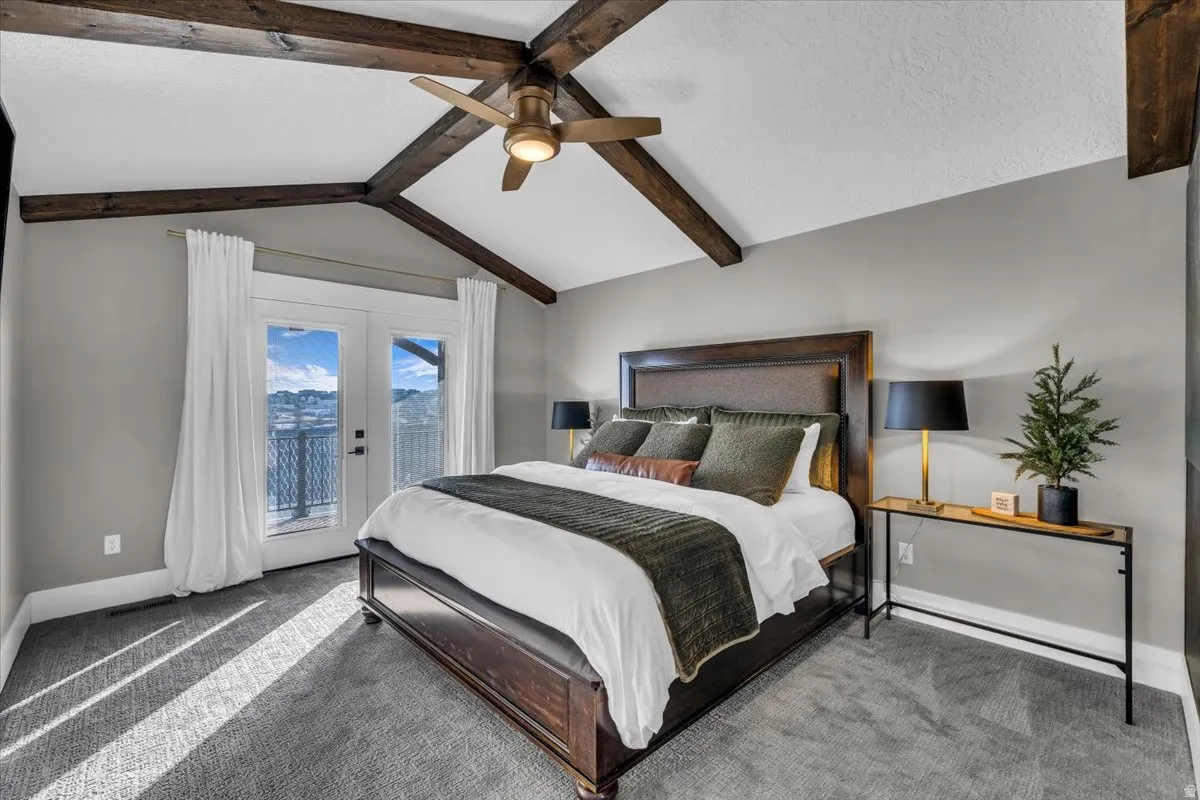 Bedroom featuring access to outside, ceiling fan, carpet flooring, beamed ceiling, and french doors