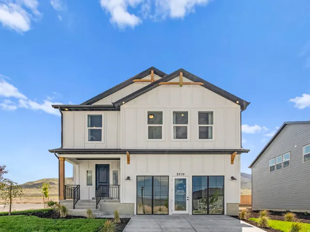 Modern farmhouse style home with board and batten siding and covered porch