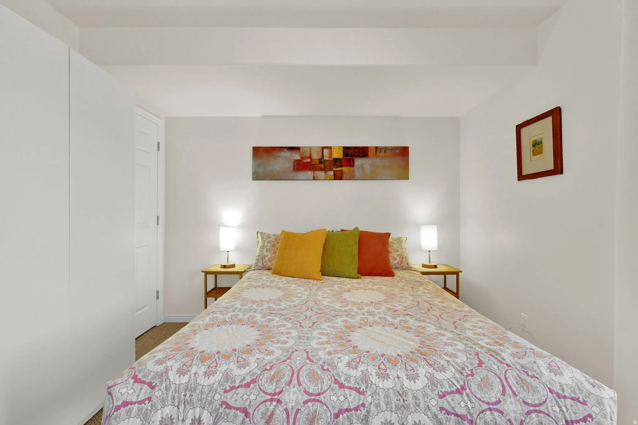 Bedroom featuring white walls and a carpeted floor