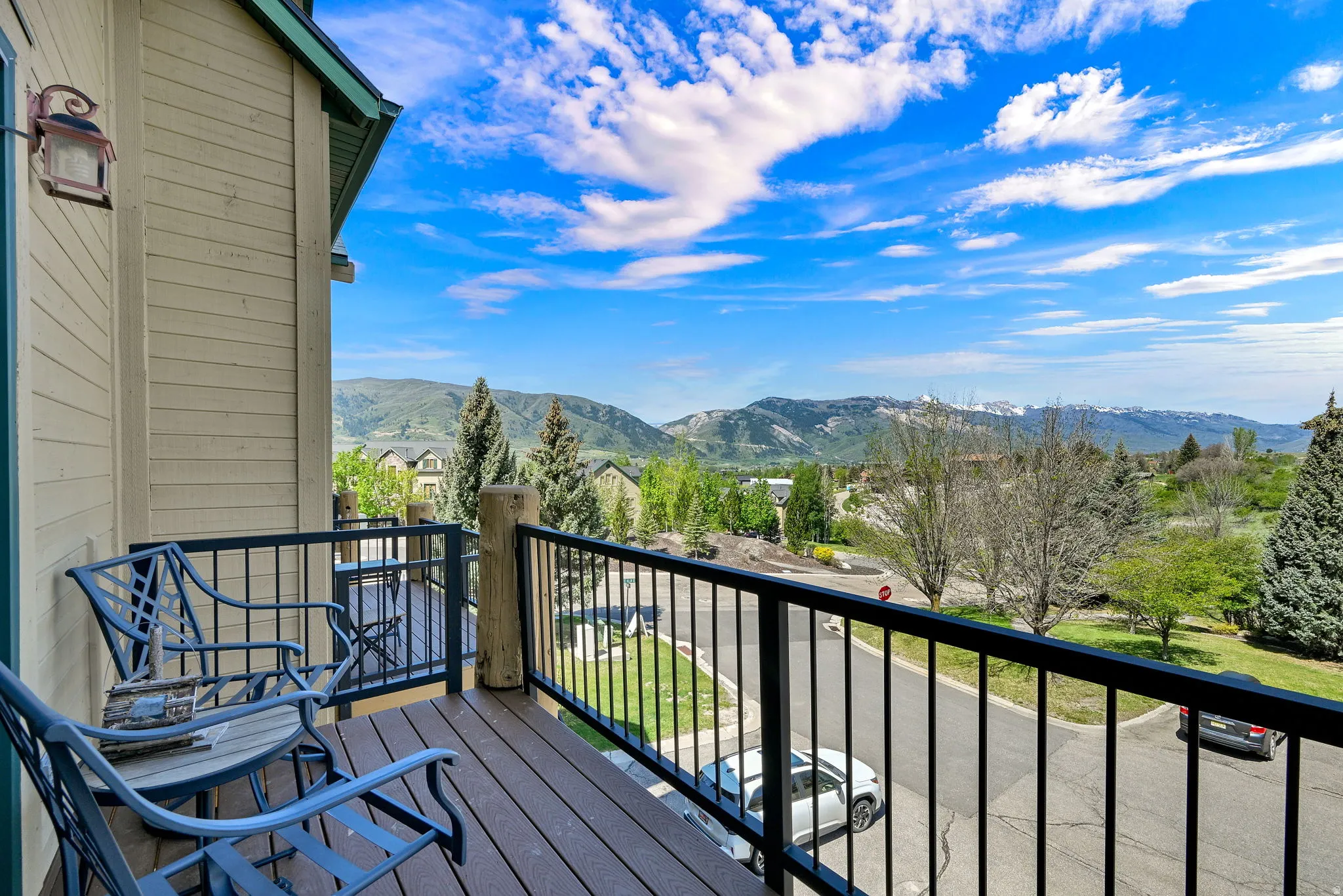 Private balcony with composite decking and black metal railings