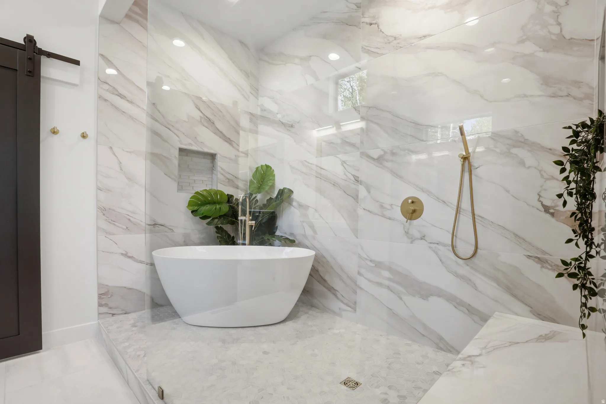 Spacious walk-in shower featuring large-format wall tiles