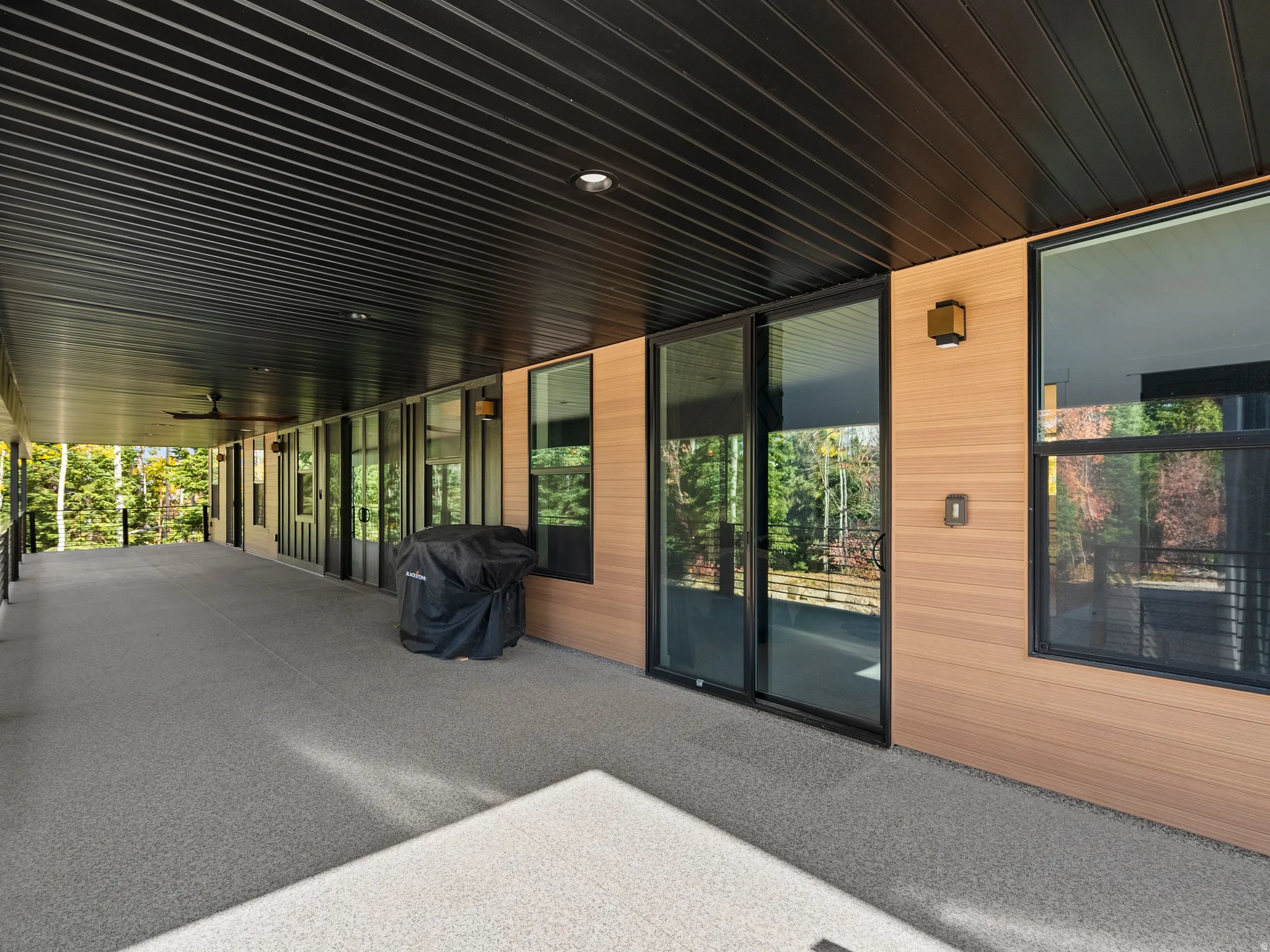 View of deck featuring a grill and ceiling fan