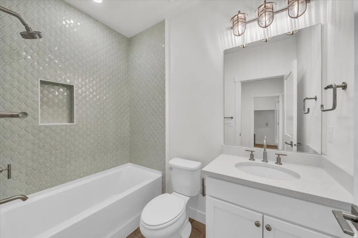 Full bathroom featuring vanity and shower / bath combination