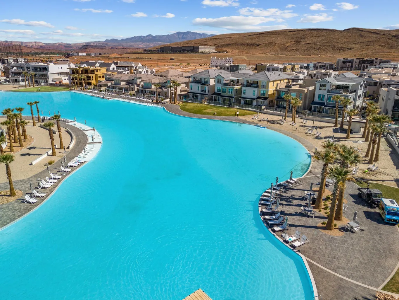 Community pool with a residential view, a mountain view, and a patio