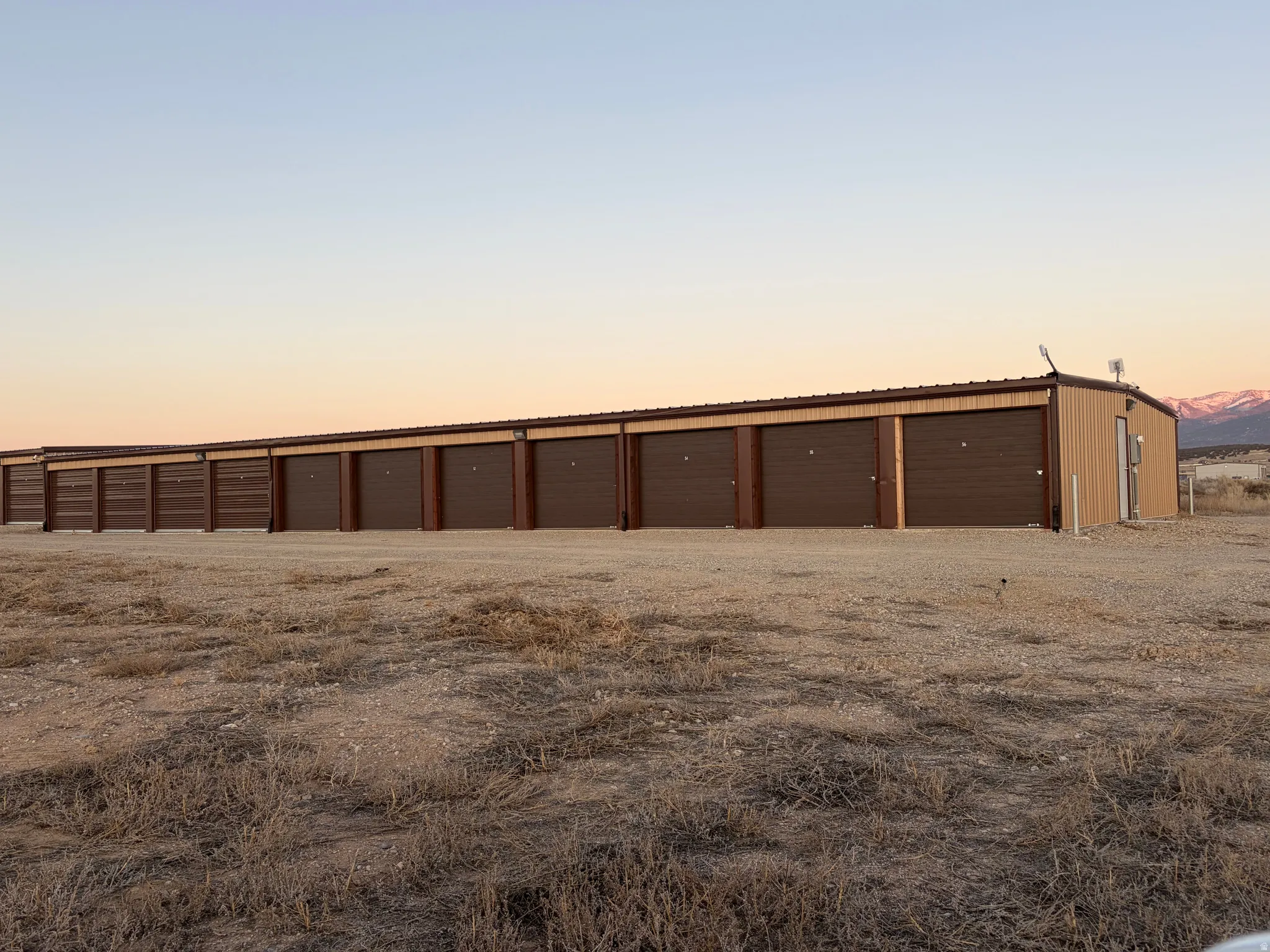 View of garage at dusk