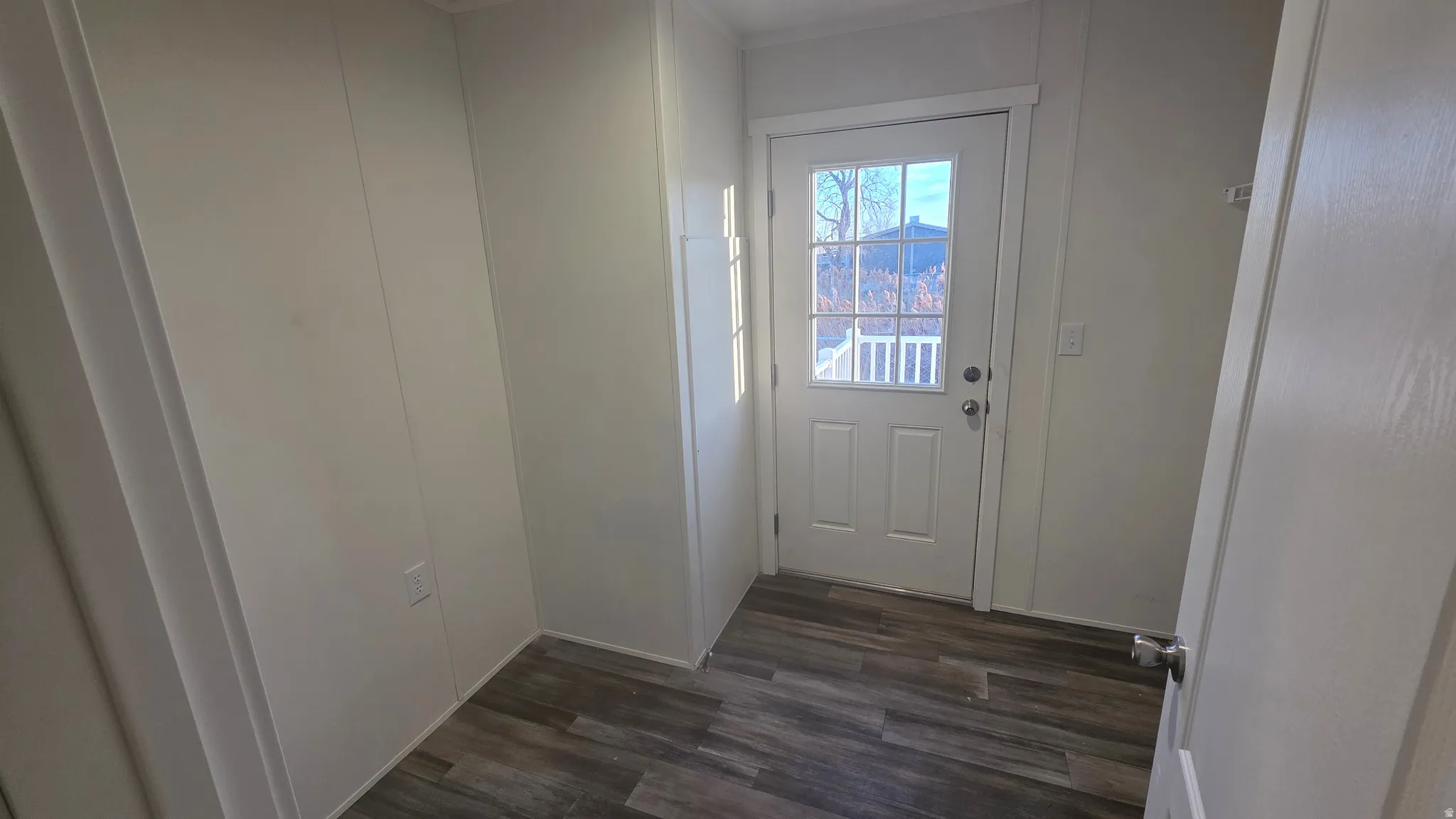 Entryway with wood finished floors