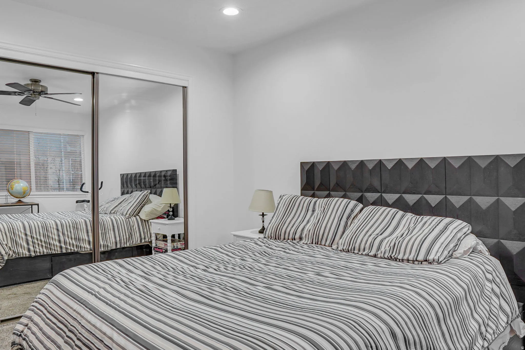 Bedroom featuring recessed lighting, carpet, and a closet