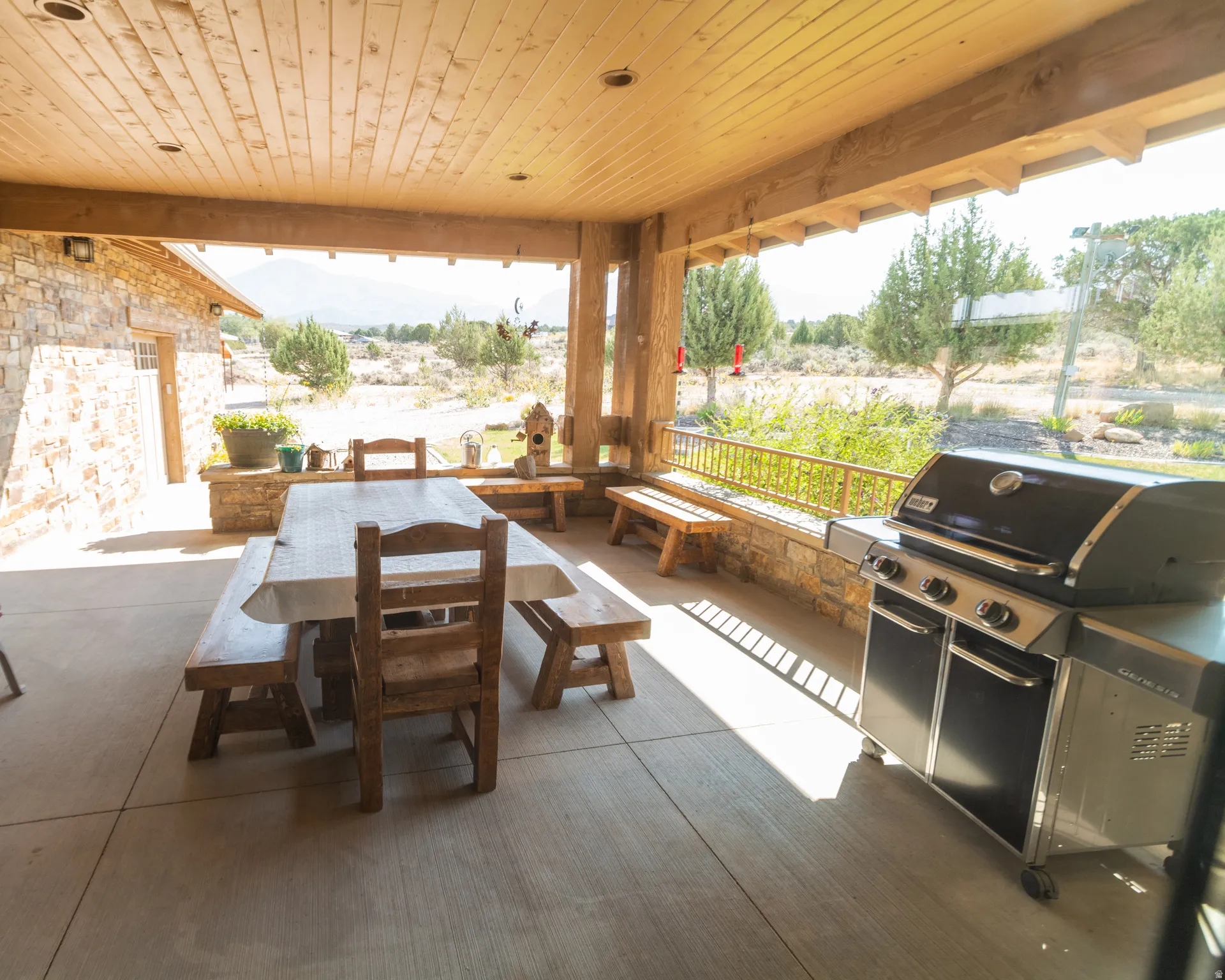 View of patio with area for grilling and outdoor dining space