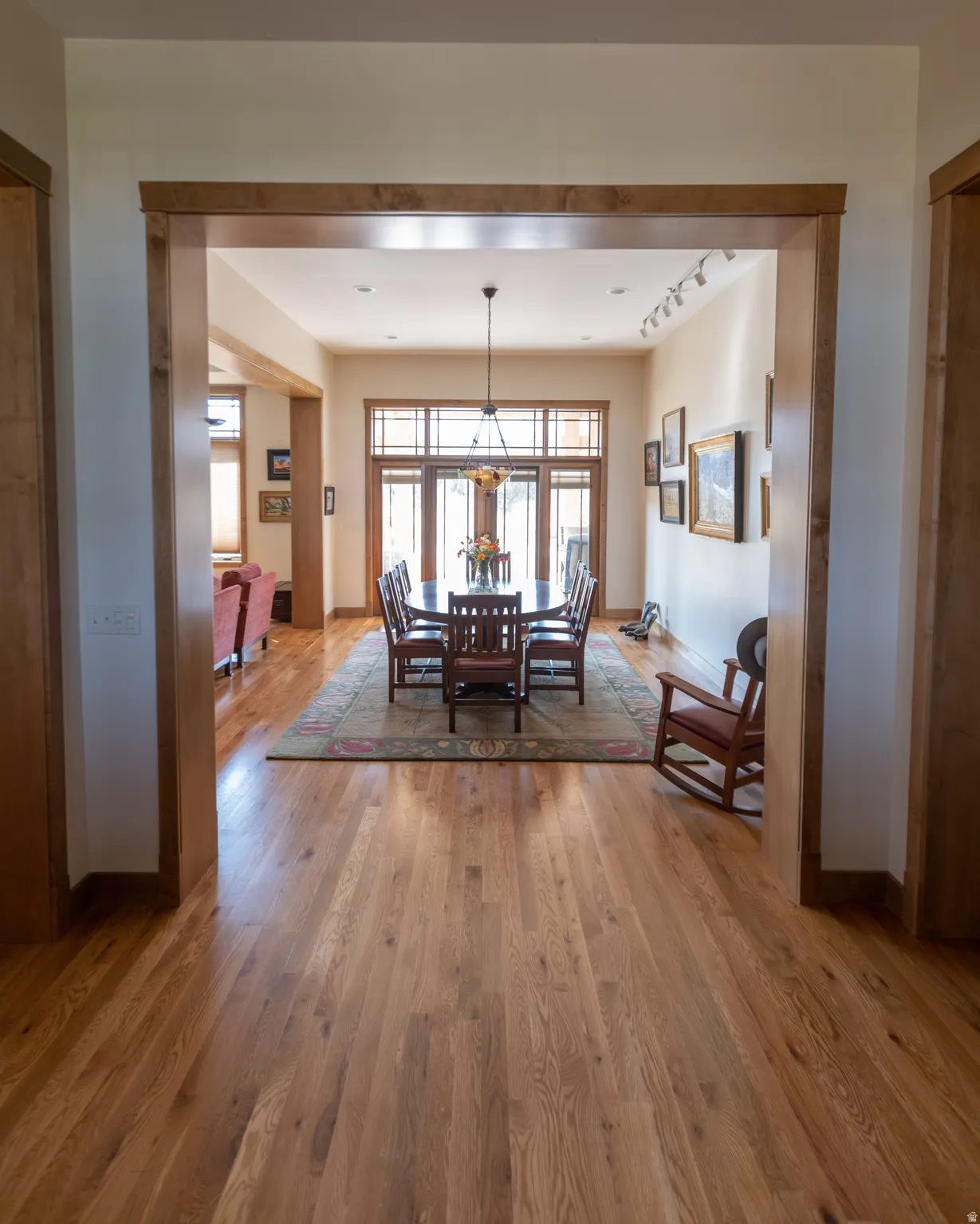 Dining area featuring light wood-type flooring and track lighting