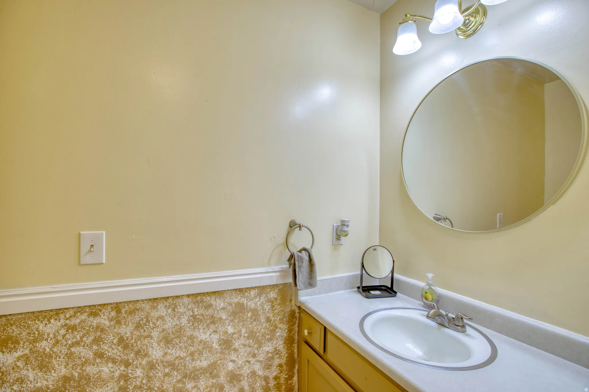 Bathroom featuring vanity and carpet