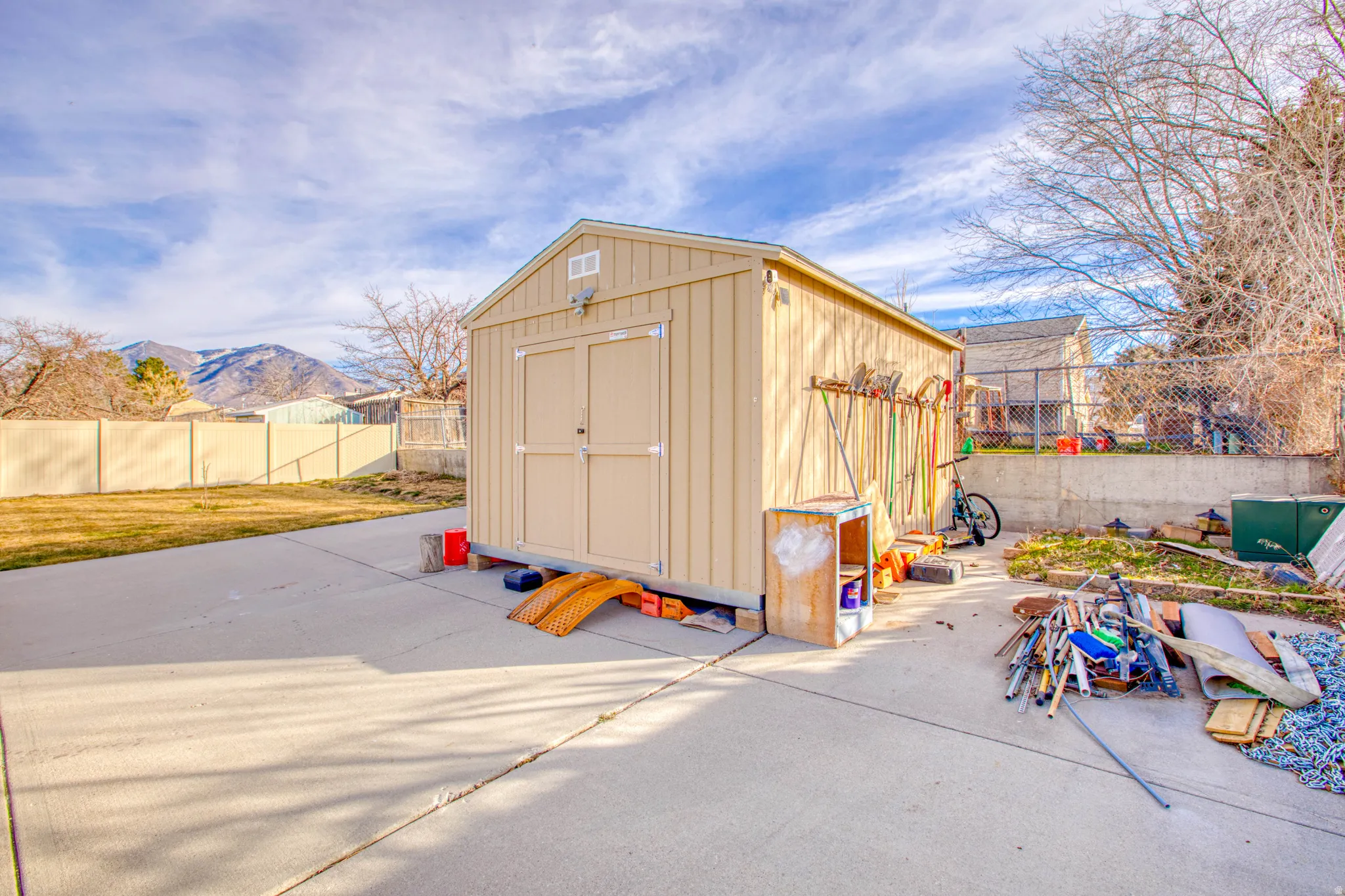 View of shed featuring a fenced backyard and a mountain view