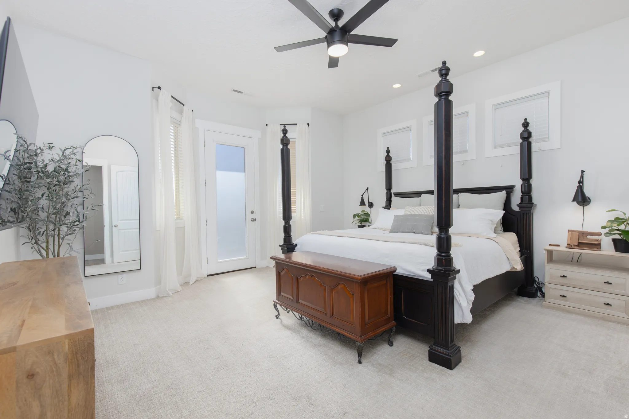 Bedroom with light carpet, recessed lighting, a ceiling fan, and access to exterior