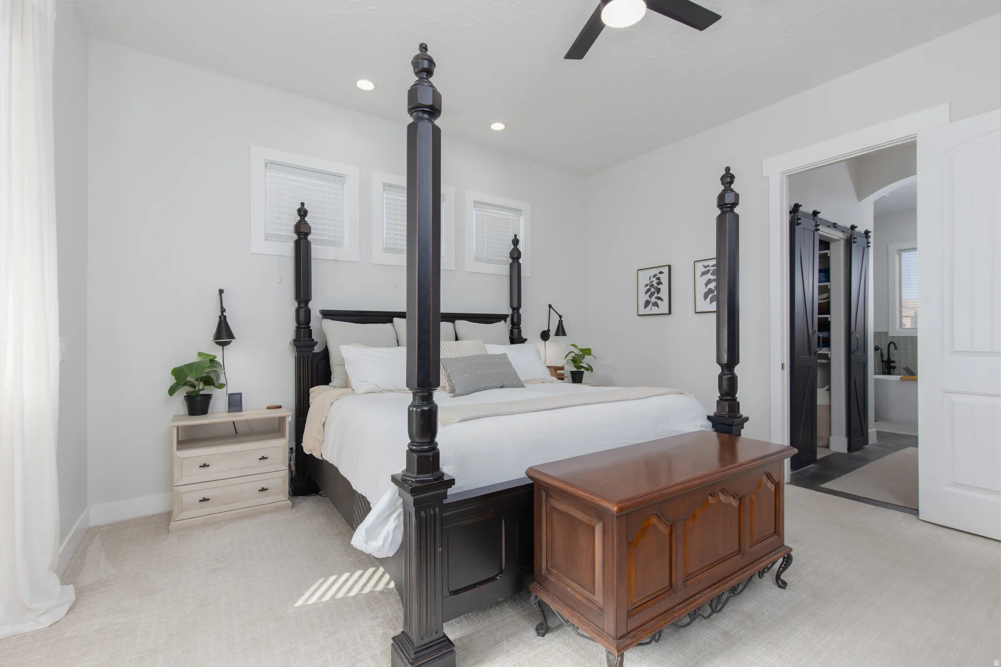 Bedroom with light colored carpet, a ceiling fan, and recessed lighting