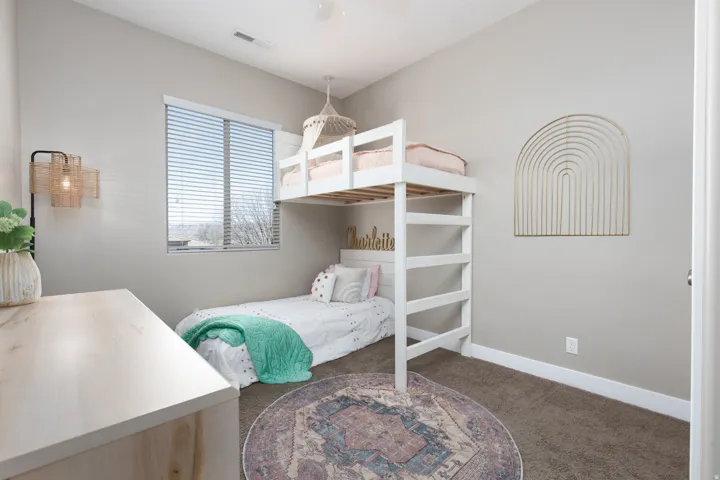 Bedroom with carpet and a ceiling fan
