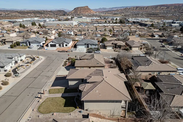 Aerial perspective of suburban area featuring a mountainous background