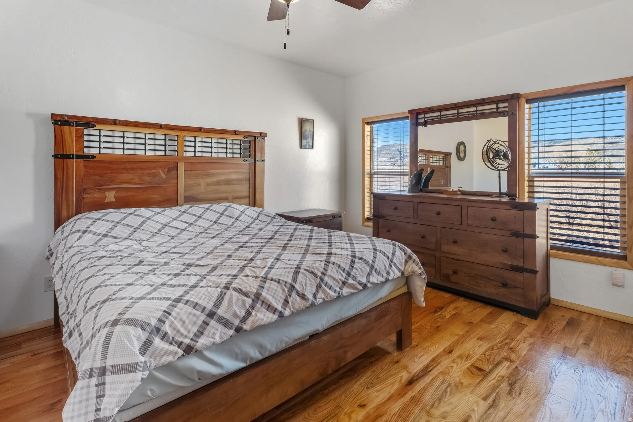 Bedroom featuring light wood-type flooring and ceiling fan
