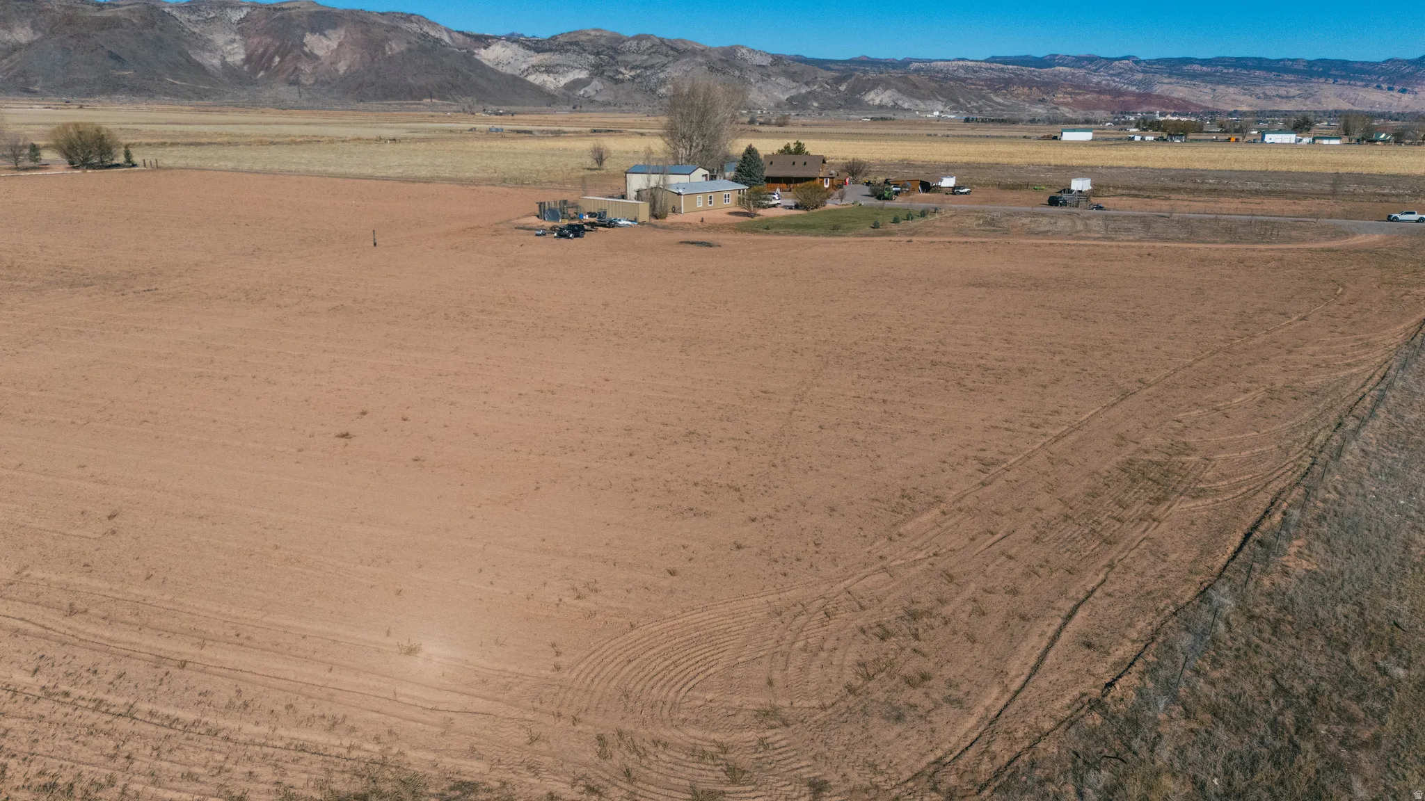 Overview of rural landscape featuring a mountain backdrop