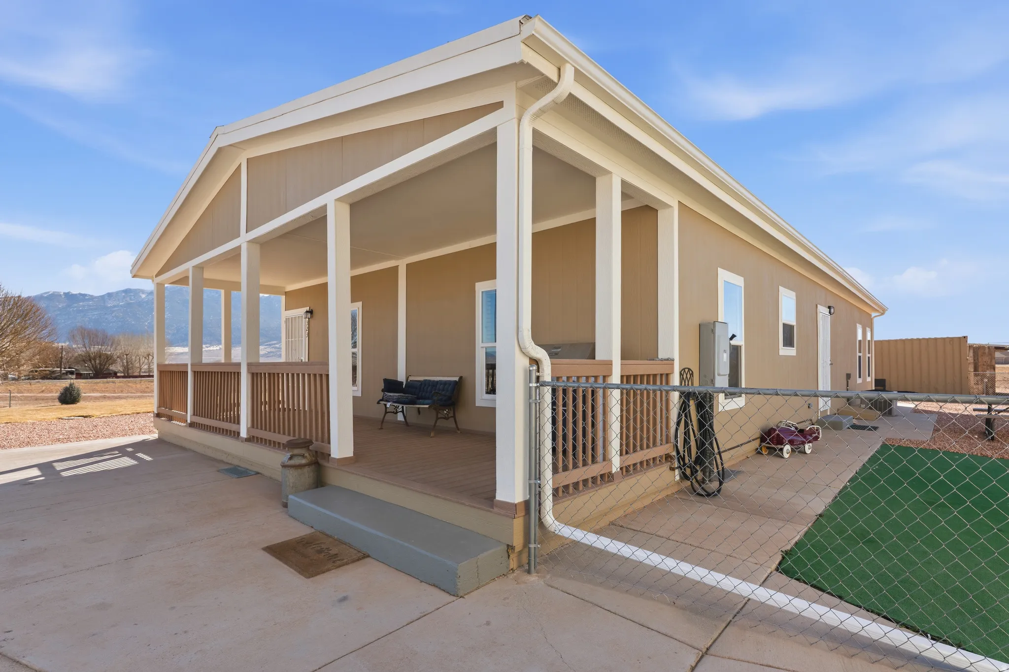 Rear view of property with covered porch