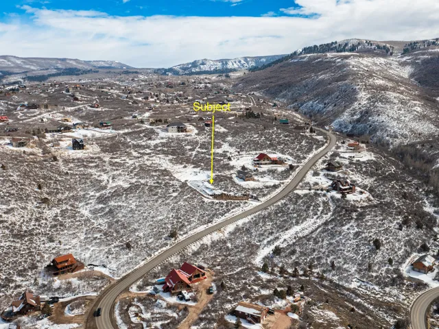 Snowy aerial view featuring a mountain view