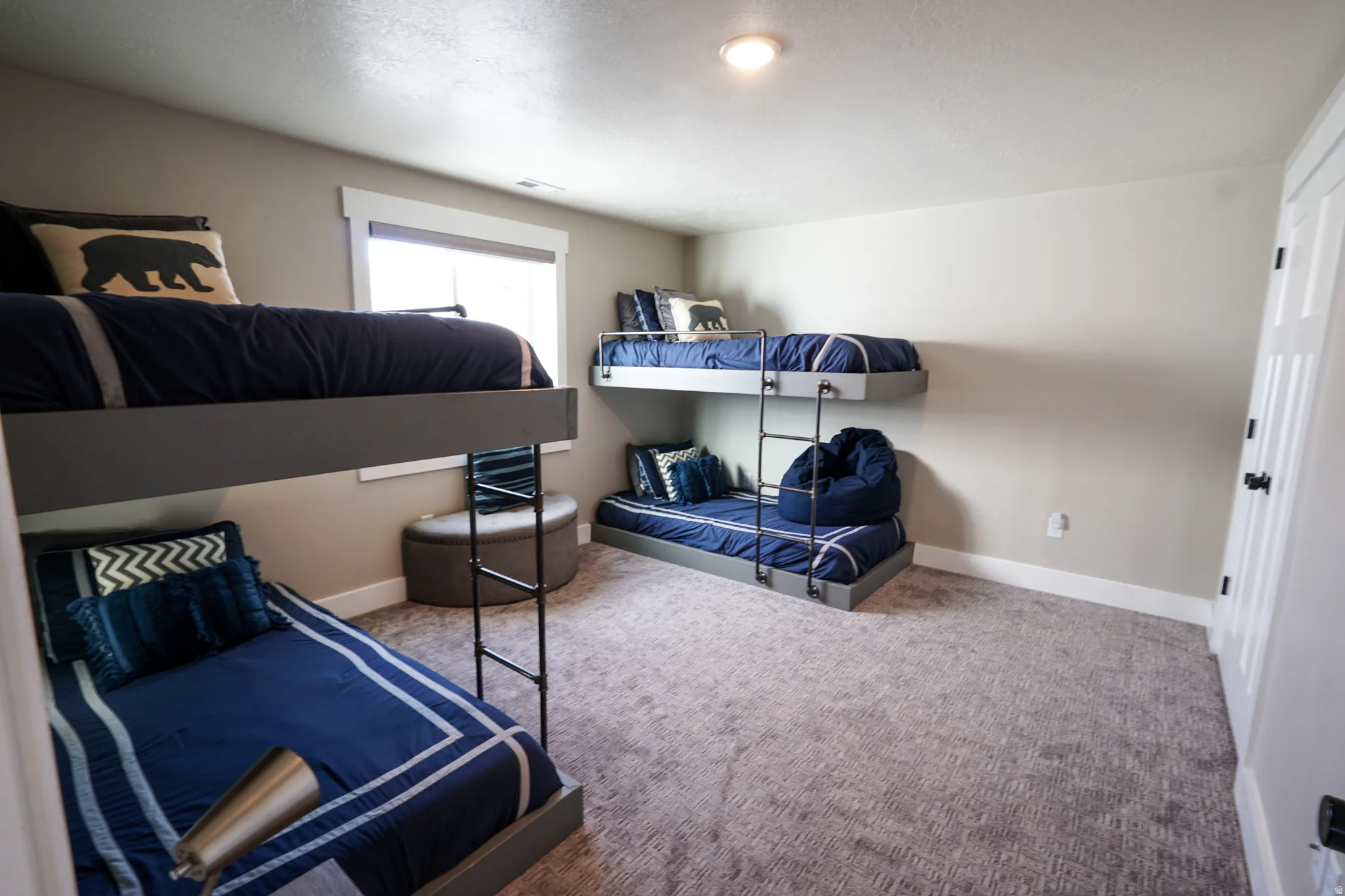 Carpeted bedroom with baseboards