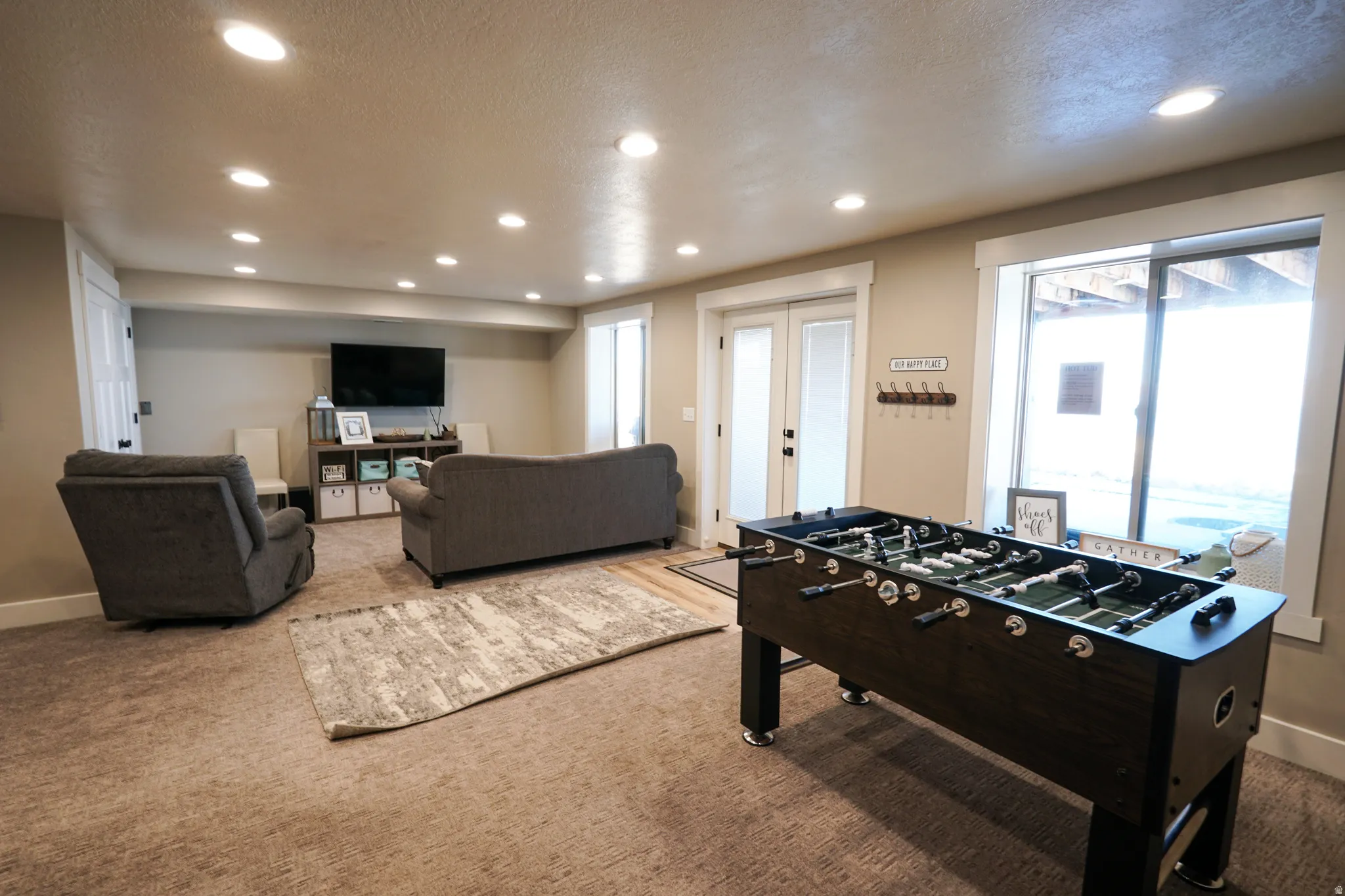 Playroom featuring recessed lighting, carpet flooring, a textured ceiling, and french doors