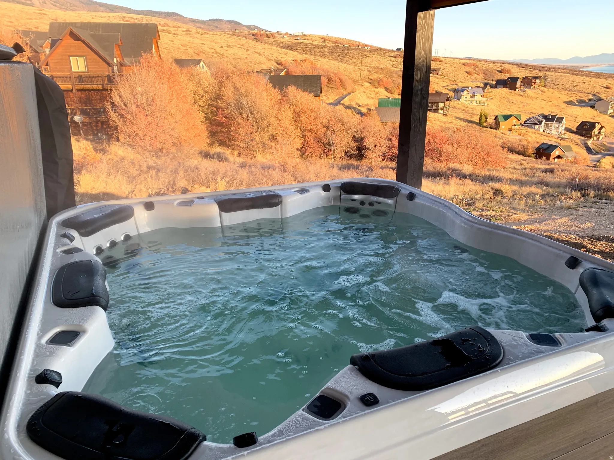 Exterior view of a mountainous background and a hot tub
