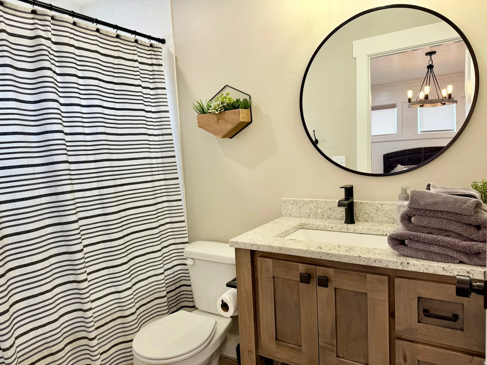 Bathroom with vanity and a shower with curtain