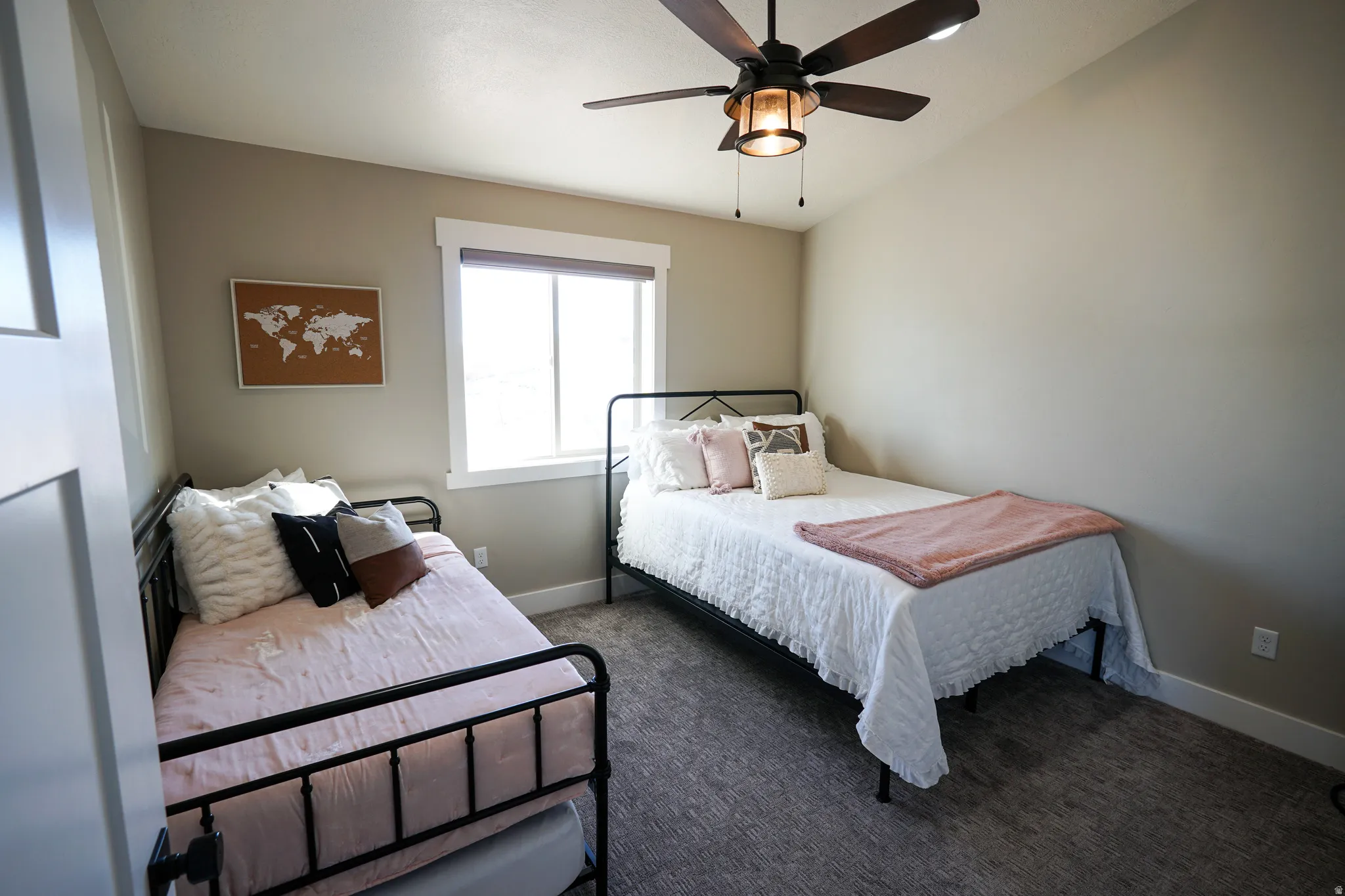 Bedroom with ceiling fan and carpet floors