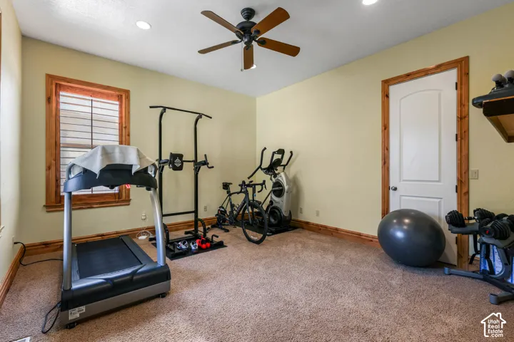 Exercise room with carpet flooring, ceiling fan, and recessed lighting