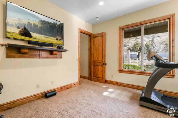 Exercise area featuring carpet flooring and recessed lighting