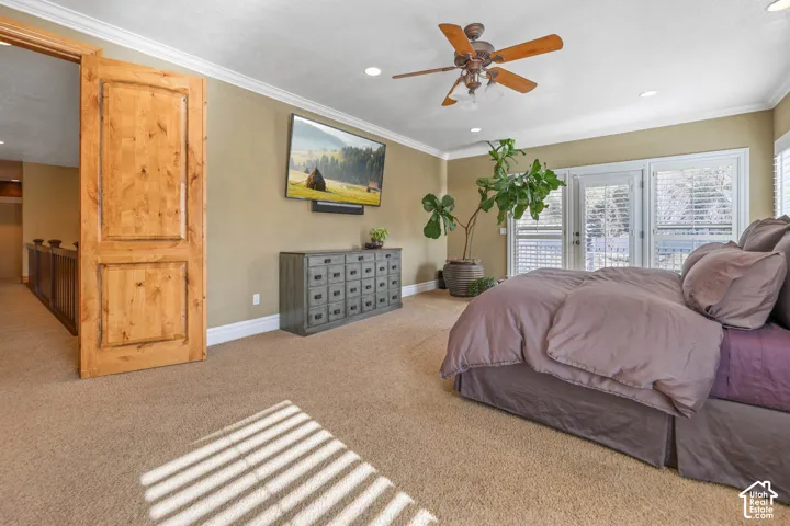 Bedroom with access to outside, carpet floors, crown molding, a ceiling fan, and recessed lighting