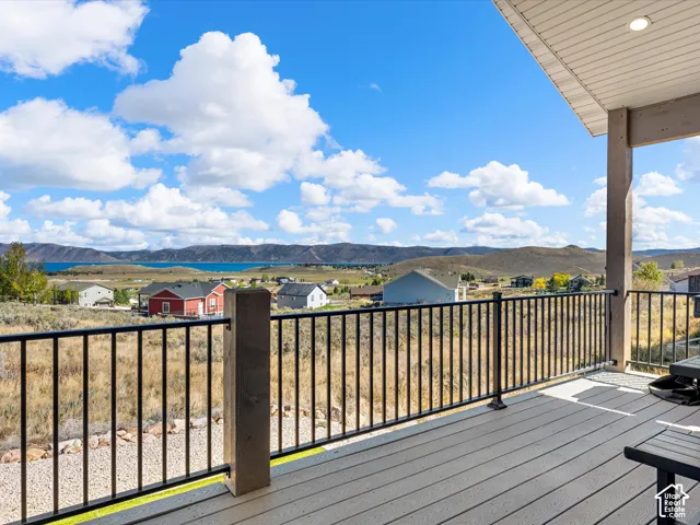 Expansive composite deck featuring a black metal railing