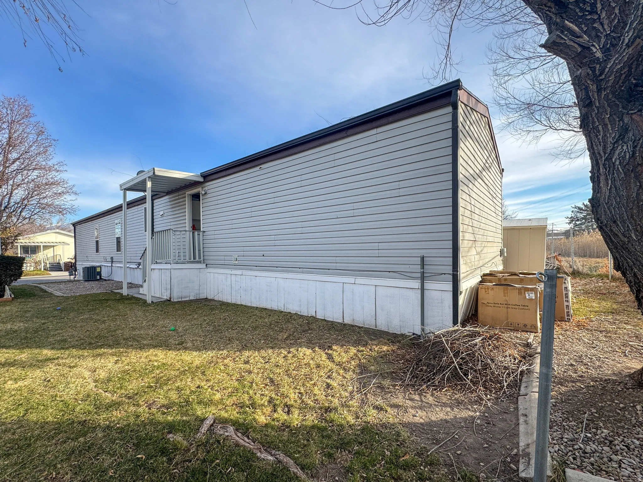 View of side of property with a yard