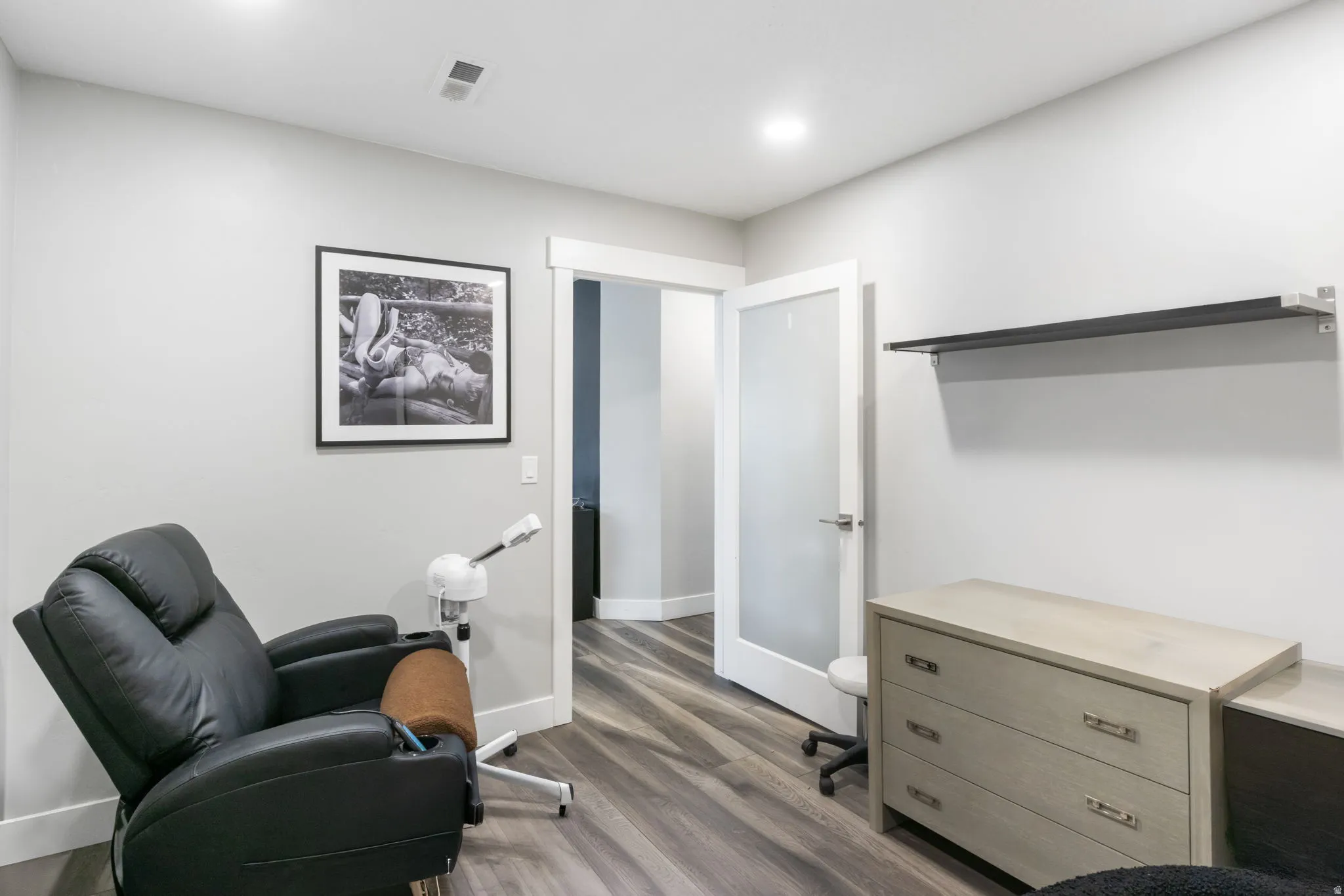 Office area with wood finished floors and baseboards