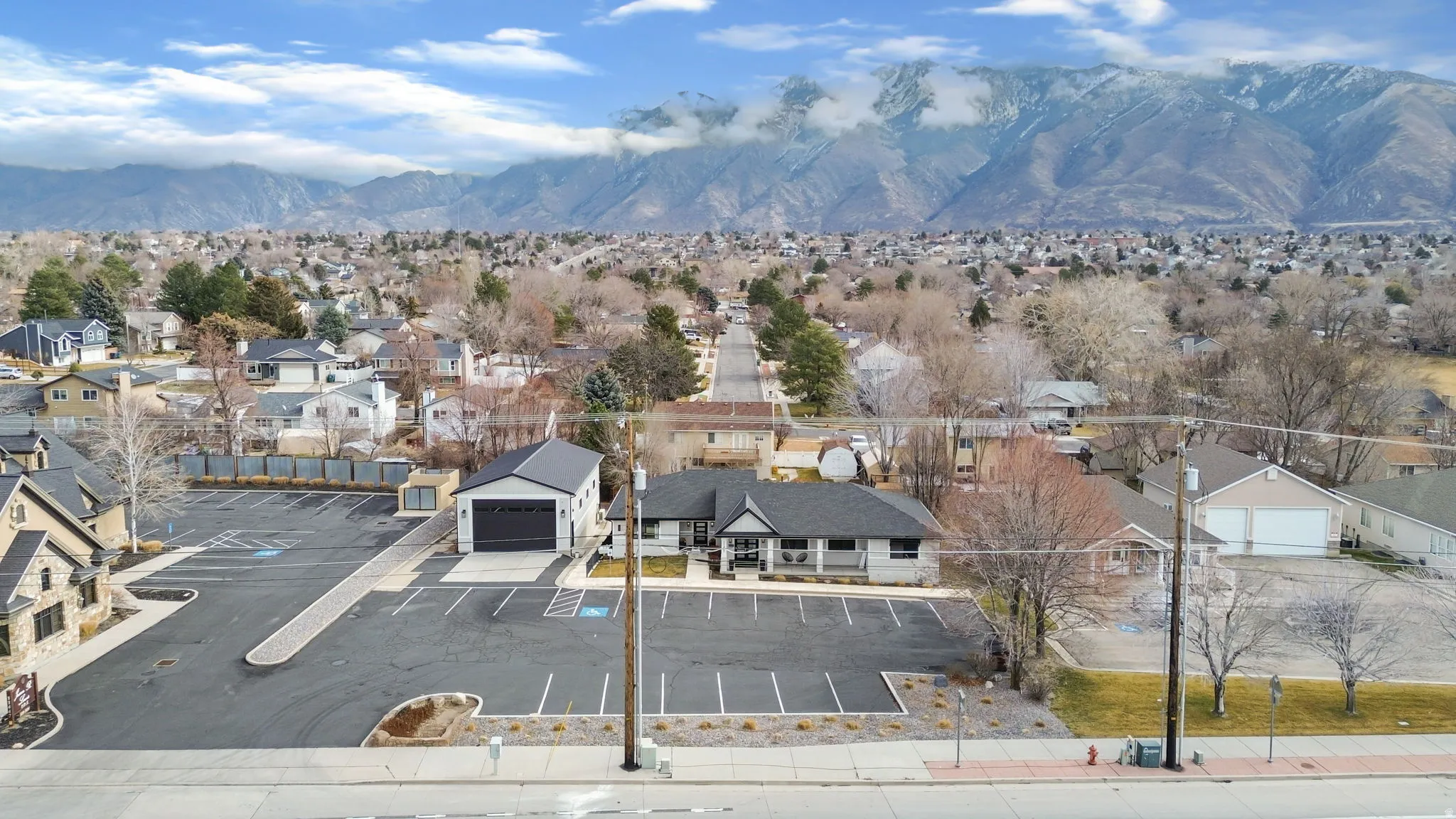 Aerial perspective of suburban area featuring a mountainous background