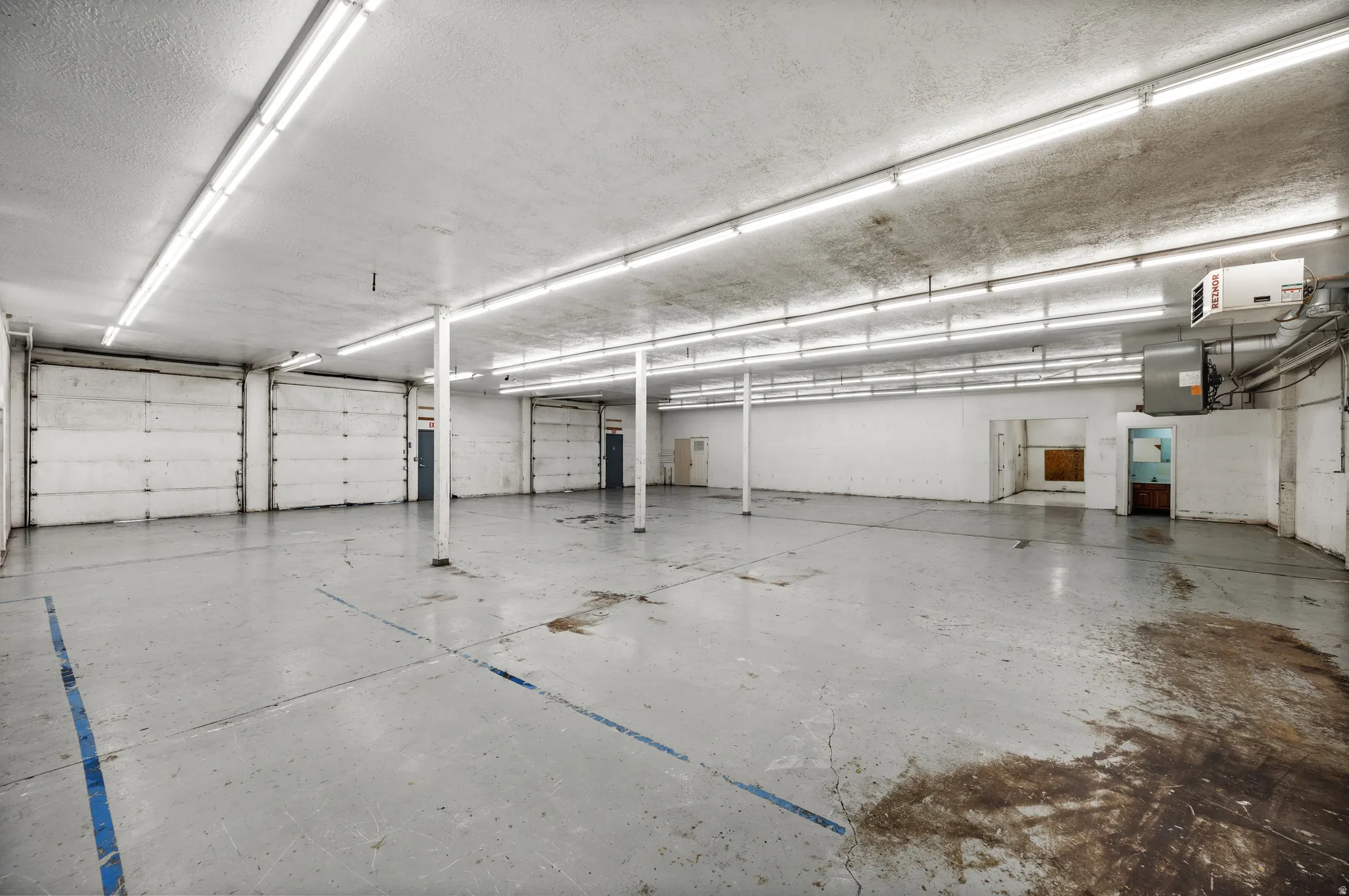 Garage featuring a heating unit