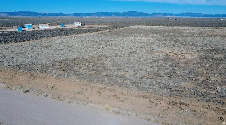 Drone / aerial view of a mountainous background and a desert landscape