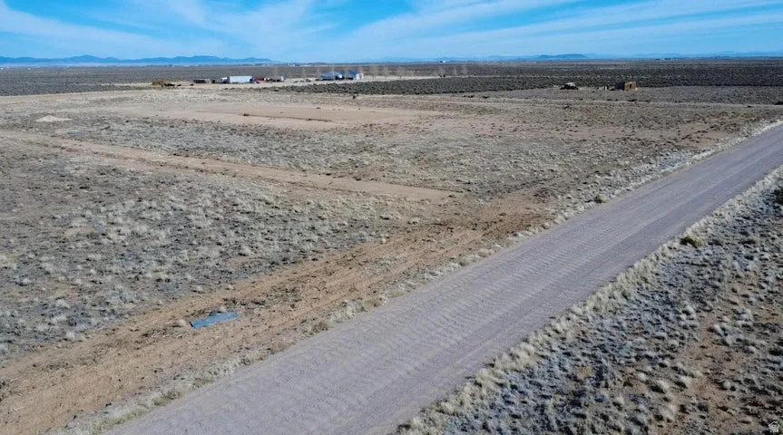 Aerial view of sparsely populated area featuring mountains and a desert landscape