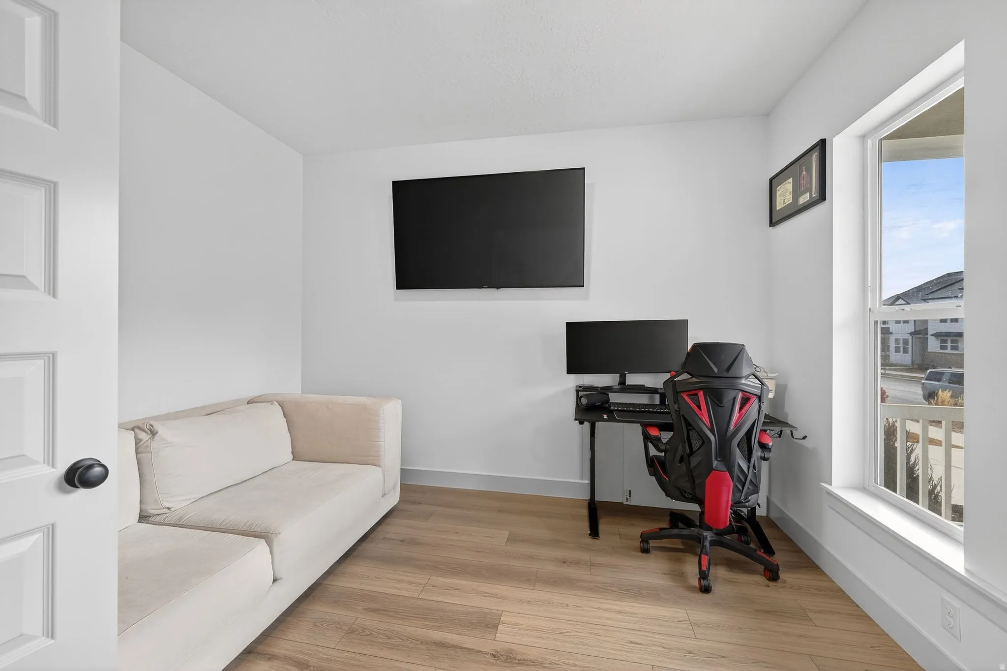 Home office featuring baseboards and light wood finished floors