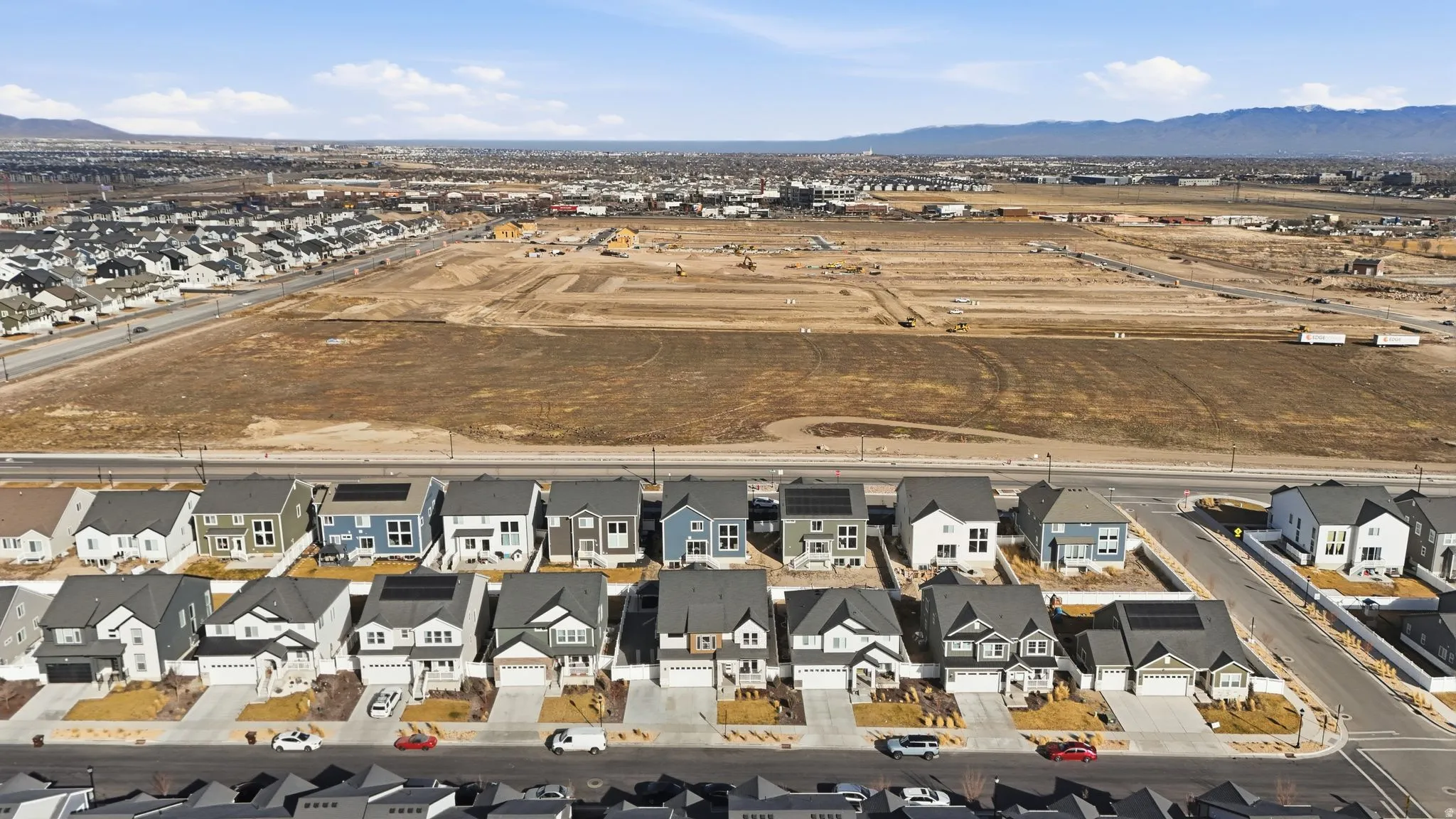 Aerial view of residential area with a mountainous background