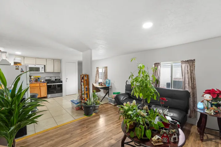 Living room featuring light wood-style flooring and recessed lighting