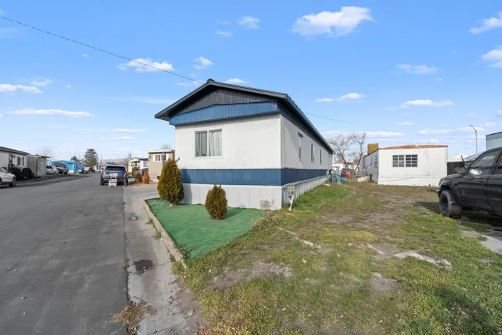 View of home's exterior featuring a residential view and a yard