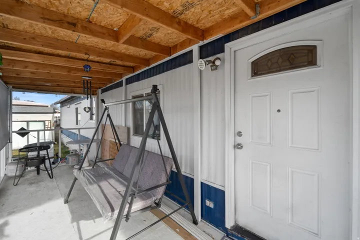 Property entrance with a patio area