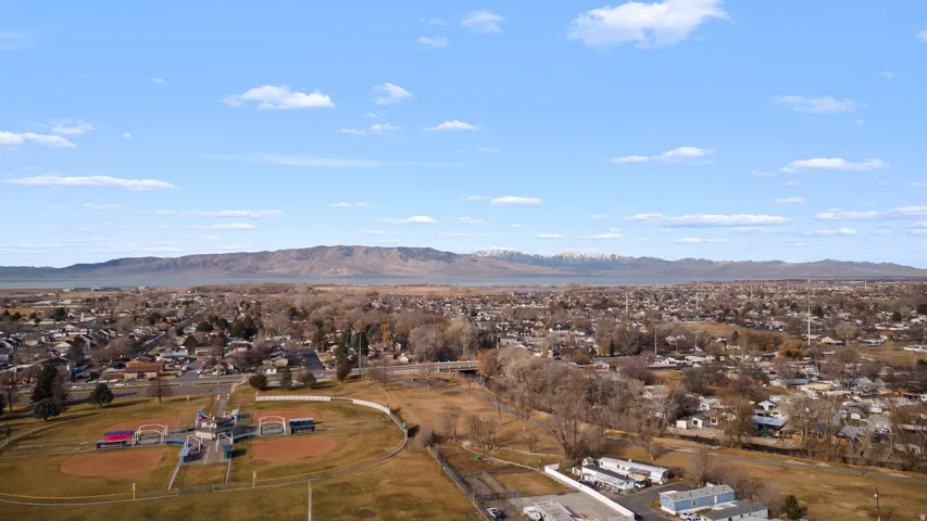 Aerial view of residential area featuring a mountainous background