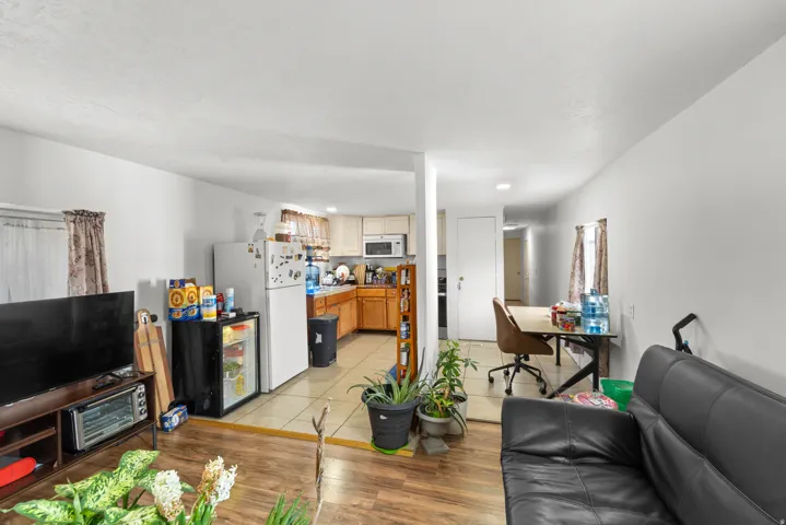Living area featuring light wood-style flooring and recessed lighting