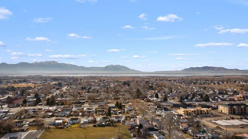 Aerial perspective of suburban area with a mountain backdrop